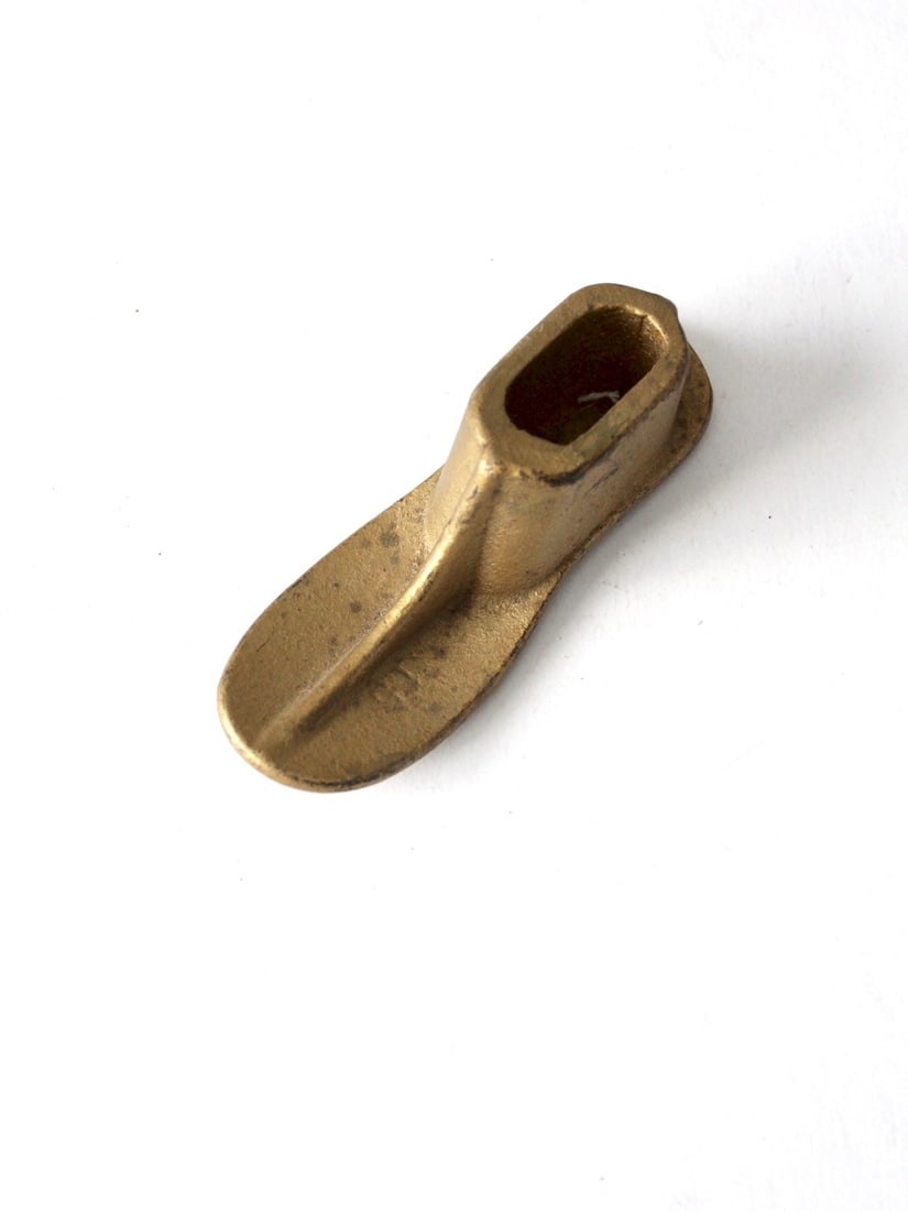 19th Century Antique Cast Iron Child Shoe Form Brass Tone Decor: 19th Century Antique Cast Iron Child Shoe Form Brass Tone Decor This antique cast iron shoe form from the 19th century is a charming representation of a child's footwear. Marked with the number "15" o