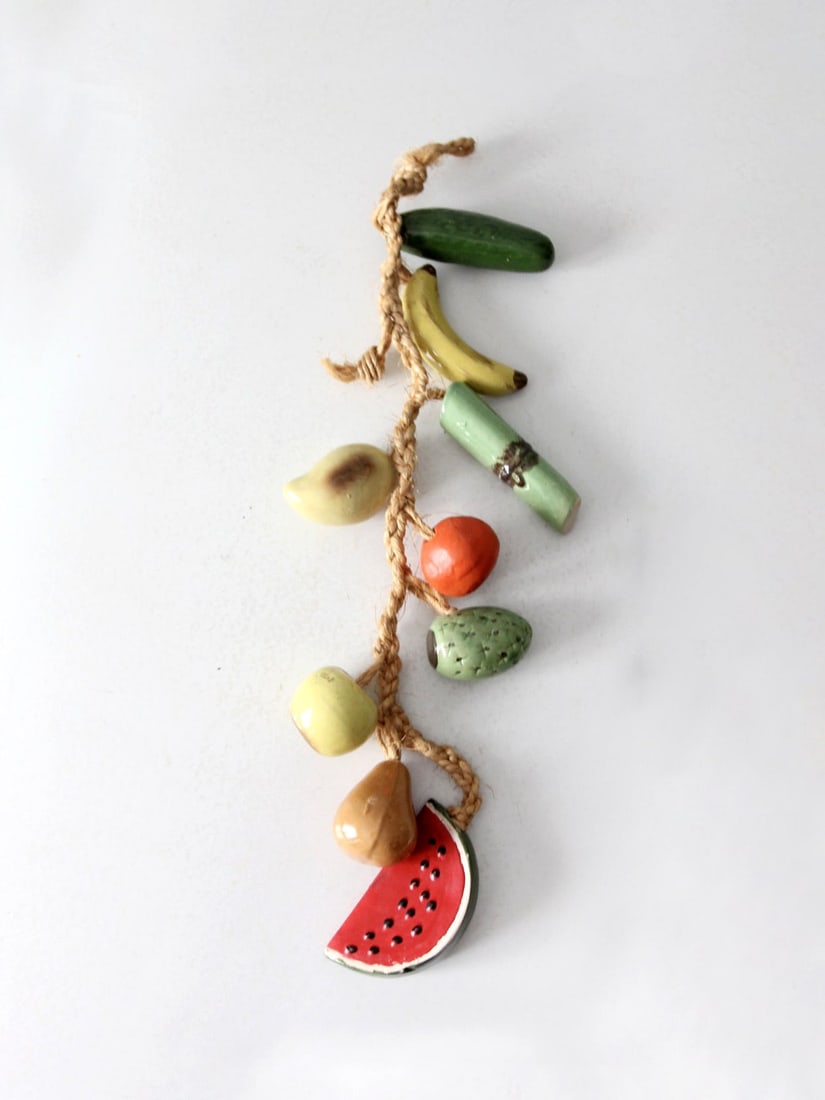 Whimsical Vintage Ceramic Fruit Hanging Decor 31 Inch: Whimsical Vintage Ceramic Fruit Hanging Decor 31 Inch Enhance your home decor with this Vintage Ceramic Fruit On Rope Hanging, a delightful piece that brings playful retro charm and vibrant colors to