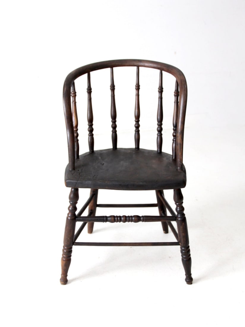 Antique Windsor Captain's Chair with Elegant Spindle Back: Antique Windsor Captain's Chair with Elegant Spindle Back This antique Windsor captain's chair showcases timeless craftsmanship with a beautifully turned spindle back, a sturdy plank seat, and elegant