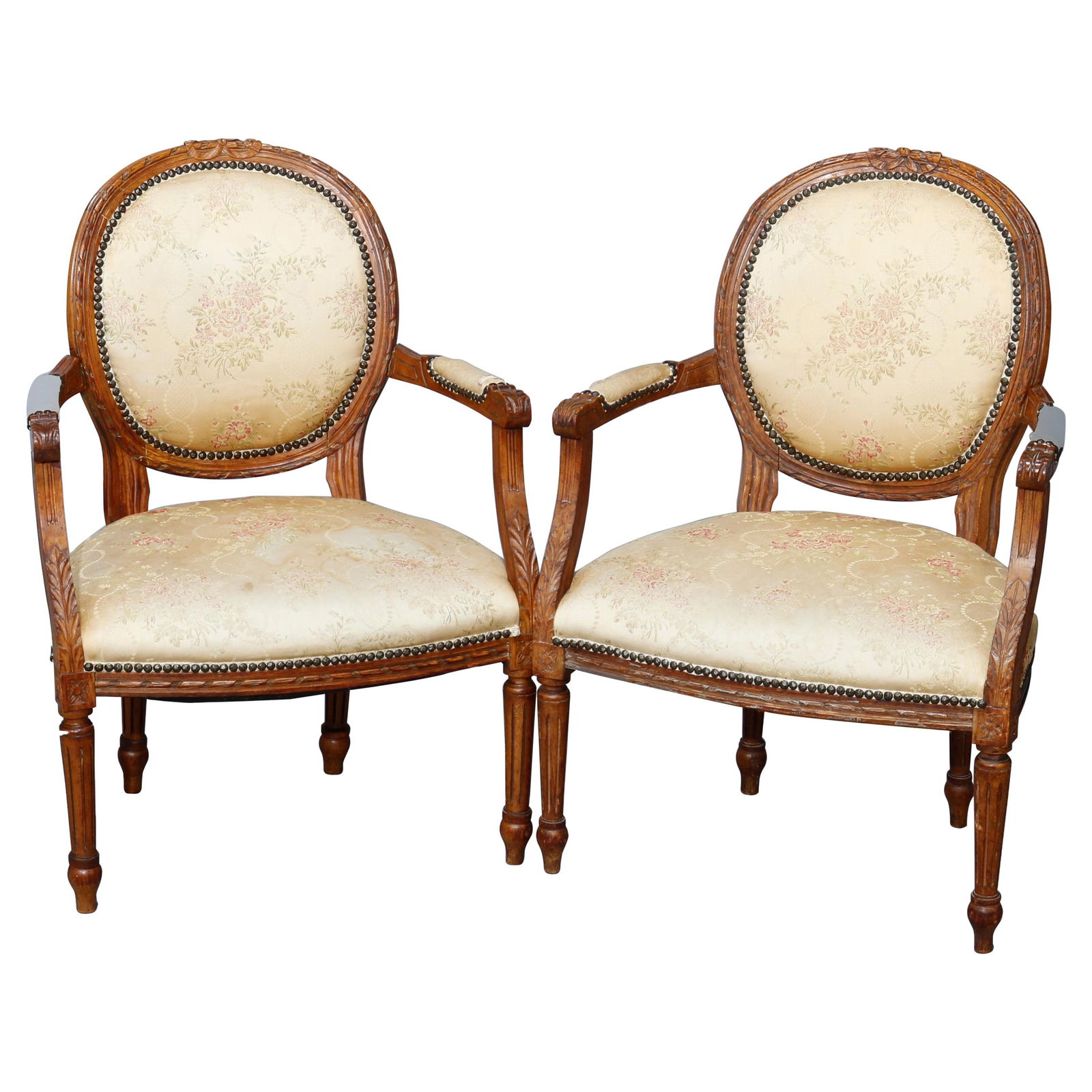 19th Century Antique French Louis XVI Carved Walnut Armchair Set of 2: 19th Century Antique French Louis XVI Carved Walnut Armchair Set of 2 This exquisite pair of antique French Louis XVI style fauteuil armchairs hails from the 19th century and features a beautifully ca