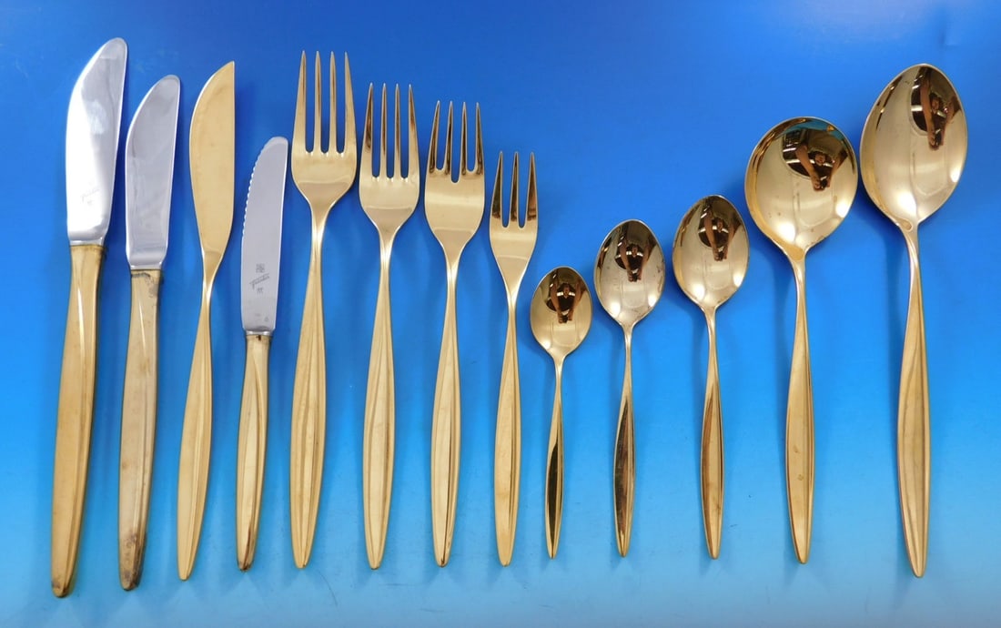 WMF Kopenhagen Gold-Washed 800 Silver Flatware Set 178 Pieces: WMF Kopenhagen Gold-Washed 800 Silver Flatware Set 178 Pieces Elevate your dining experience with the Kopenhagen Gold flatware set by WMF, crafted from 800 silver and completely gold-washed for a luxu
