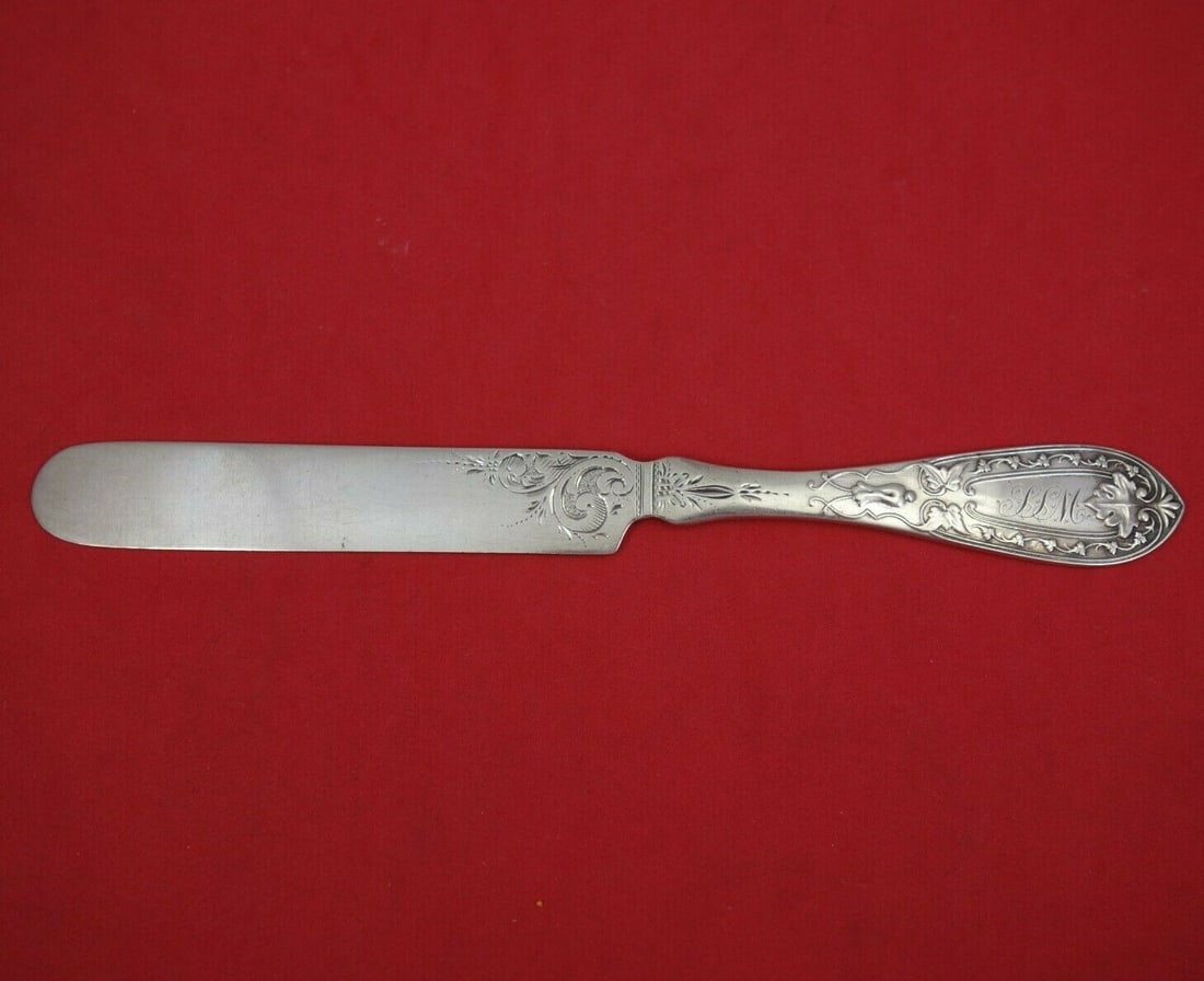 Coin Silver Tea Knife Bright-Cut Ivy Design 7 3/4" Monogrammed: Coin Silver Tea Knife Bright-Cut Ivy Design 7 3/4" Monogrammed This exquisite tea knife features a bright-cut design adorned with ivy motifs, crafted entirely from coin silver. With a flat handle and