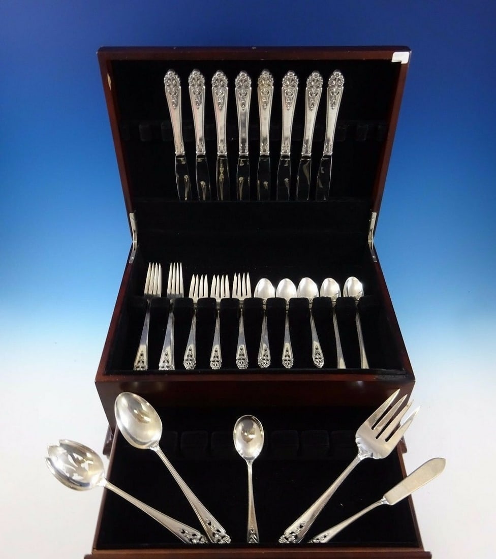 International Silver Queen's Lace 45 Pc Sterling Silver Flatware Set: International Silver Queen's Lace 45 Pc Sterling Silver Flatware Set Enhance your dining experience with this exquisite 45-piece Queen's Lace flatware set by International Sterling. Crafted from high-