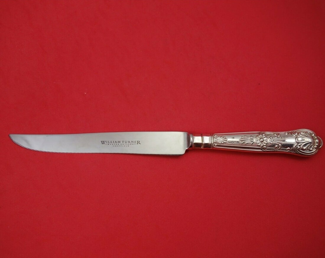William Turner Queens Sterling Silver Steak Carving Knife 10 1/2": William Turner Queens Sterling Silver Steak Carving Knife 10 1/2" This exquisite steak carving knife features a sterling silver hollow handle, crafted in the elegant Queens pattern by renowned maker W