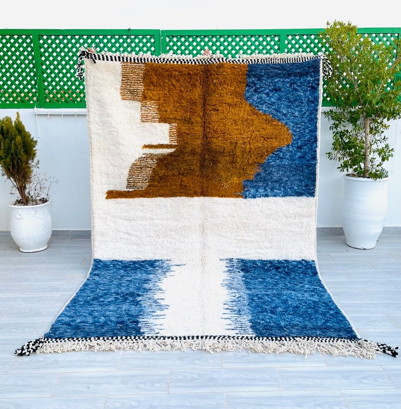 Authentic Handmade Moroccan Berber Wool Area Rug 9.84 x 6.56 Feet: Authentic Handmade Moroccan Berber Wool Area Rug 9.84 x 6.56 Feet Experience the charm of this Elegant Authentic Soft Colorful Handmade Moroccan Berber Wool Area Rug. Meticulously handwoven in the Atl