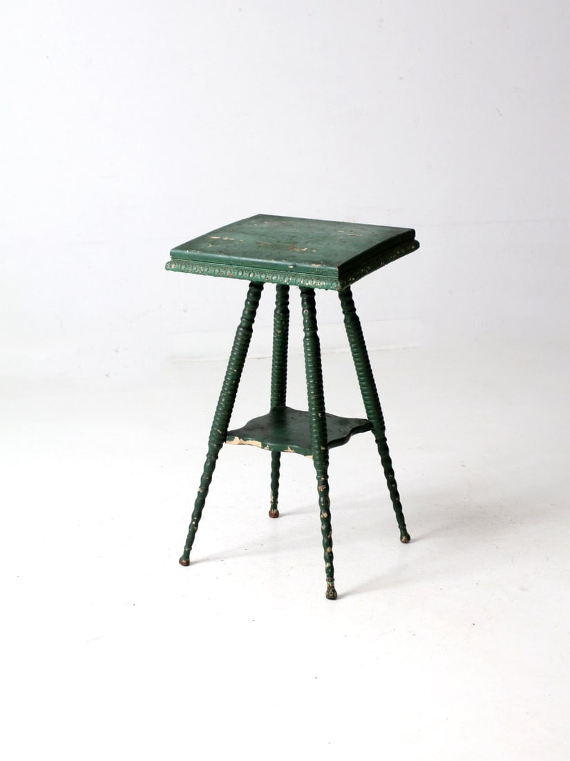 Antique Victorian Green Accent Table with Carved Details: Antique Victorian Green Accent Table with Carved Details Enhance your living space with this exquisite antique Victorian accent table. Featuring a weathered green paint finish and intricately carved d