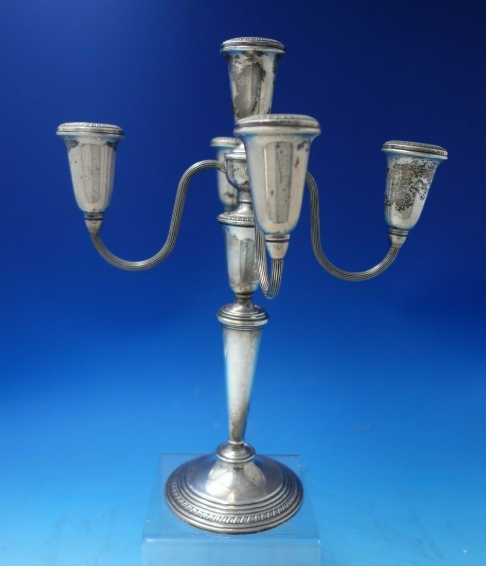 Poole Gadroon Sterling Silver 5-Light Candelabra 10" Tall: Poole Gadroon Sterling Silver 5-Light Candelabra 10" Tall Introducing the Gadroon by Poole Sterling Silver Candelabra, a stunning five-light piece that embodies elegance and historical charm. Crafted