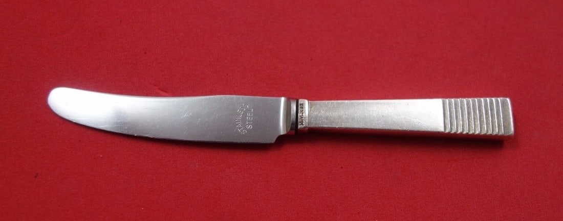 Georg Jensen Parallel Sterling Silver Baby Knife 4 3/4 inches: Georg Jensen Parallel Sterling Silver Baby Knife 4 3/4 inches This exquisite baby knife, crafted by Georg Jensen, features a sterling silver hollow handle complemented by a stainless steel blade. Meas