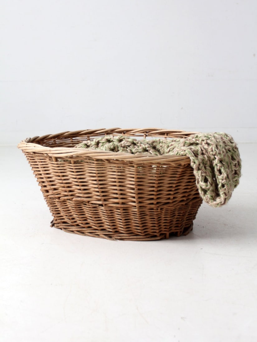 Vintage Oval Wicker Basket with Aged Patina 20 x 19.5 x 16.5: Vintage Oval Wicker Basket with Aged Patina 20 x 19.5 x 16.5 This antique oval wicker basket showcases a softly flared rim and a beautifully aged patina that enhances the depth and texture of its hand