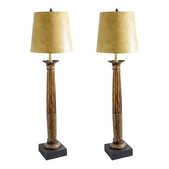 French 19th Century Fluted Gilt Wood Floor Lamp Pair: French 19th Century Fluted Gilt Wood Floor Lamp Pair This exquisite pair of floor lamps is crafted from 19th-century Ionic fluted gilt wood columns, showcasing the elegance of French design. Each lamp