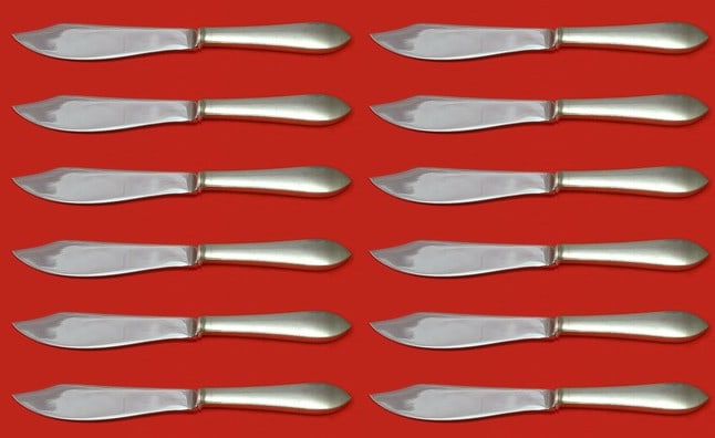Tiffany & Co Faneuil Sterling Silver Fish Knife Set of 12 Custom 8 1/4 in: Tiffany & Co Faneuil Sterling Silver Fish Knife Set of 12 Custom 8 1/4 in Enhance your dining experience with this exquisite set of 12 Faneuil fish knives by Tiffany & Co. Each knife features a stunni