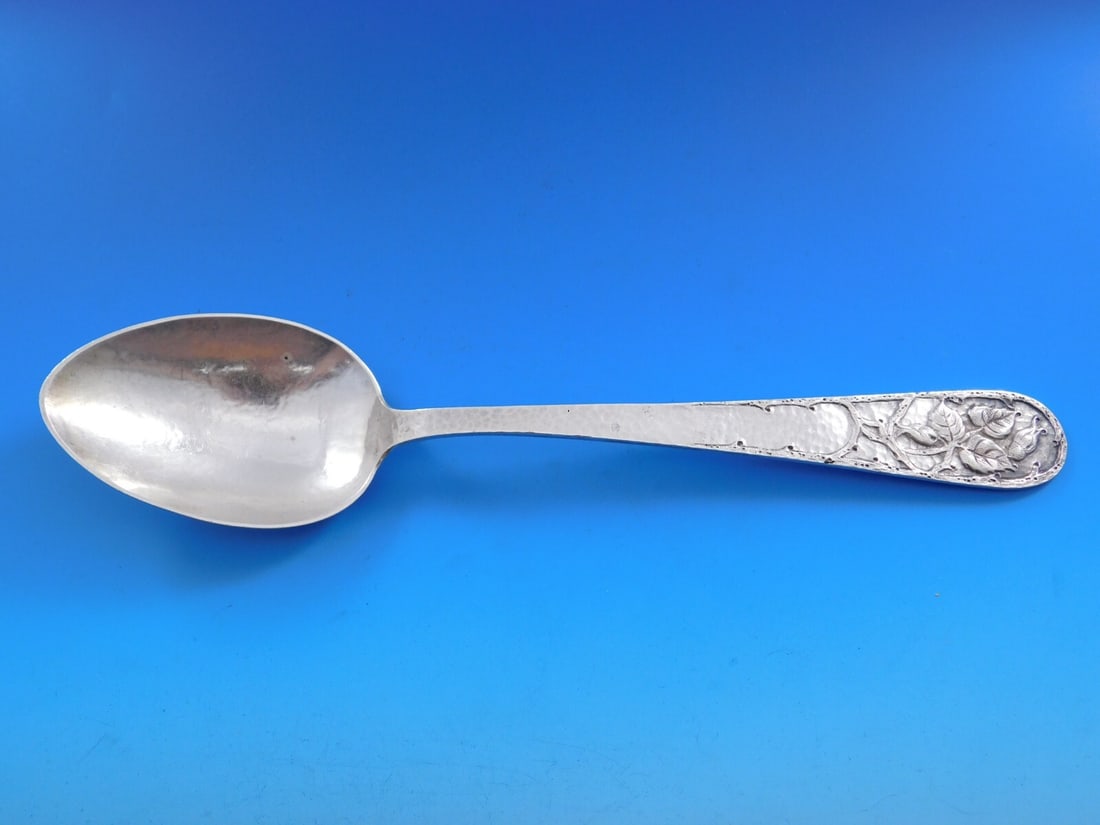 Marshall Field Sterling Silver Handwrought Vegetable Serving Spoon 10 3/8": Marshall Field Sterling Silver Handwrought Vegetable Serving Spoon 10 3/8" This exquisite vegetable serving spoon from Marshall Field and Co. features a beautifully handwrought design adorned with flo