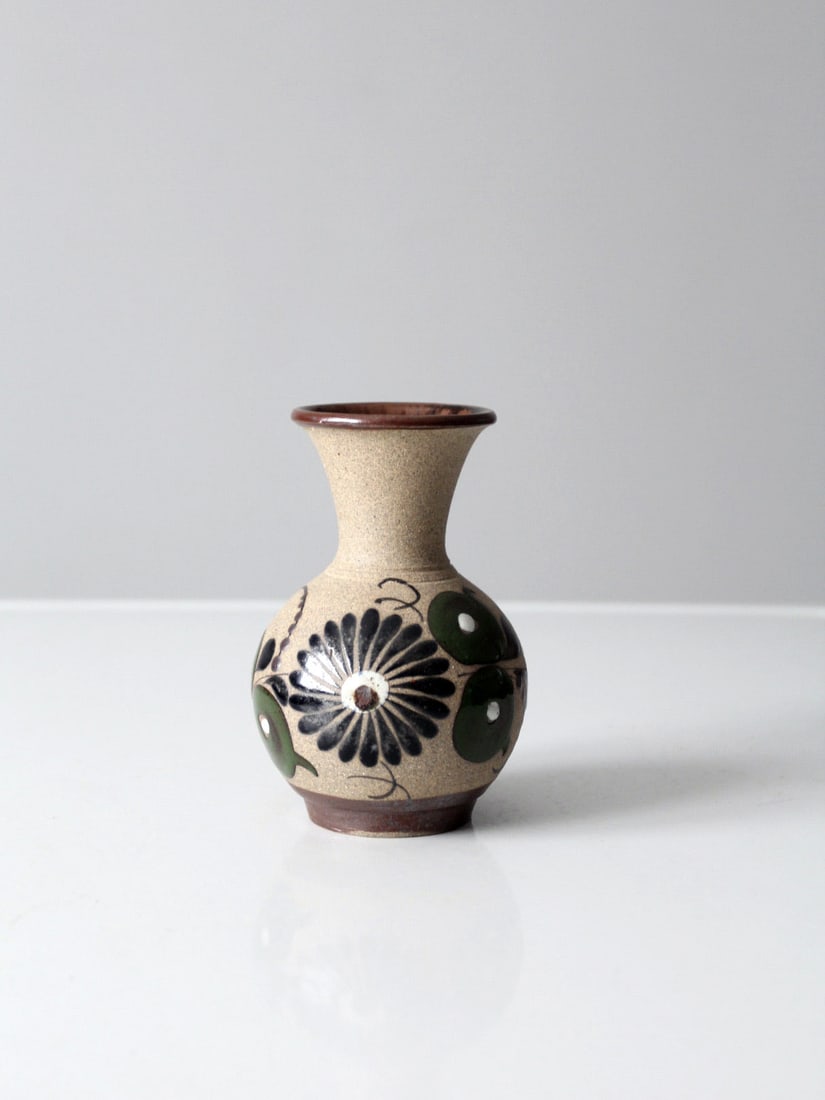 Mid-Century Tonala Pottery Vase by Tecat Hand-Painted Floral Design: Mid-Century Tonala Pottery Vase by Tecat Hand-Painted Floral Design This mid-century Tonala pottery vase showcases exquisite craftsmanship from Mexico. Signed by the artist Tecat, this beautiful ceram