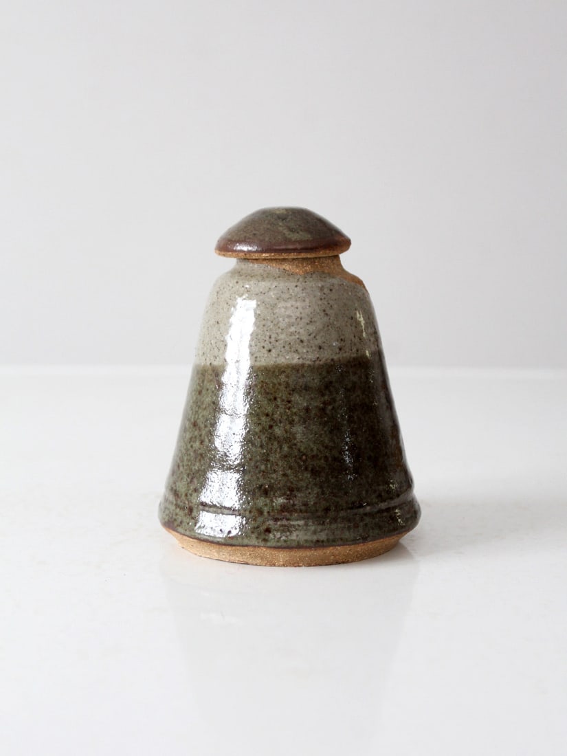 Handmade Vintage Stoneware Jar with Fitted Lid: Handmade Vintage Stoneware Jar with Fitted Lid This vintage handmade stoneware jar showcases a beautifully hand-thrown form and a warm, earthy glaze. It features a small, fitted lid, making it an idea