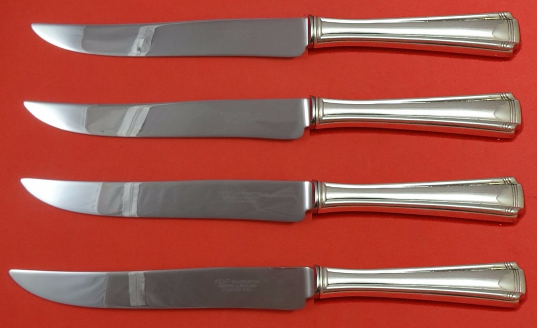 Westmorland John and Priscilla Sterling Silver Texas Steak Knife Set 4-Piece: Westmorland John and Priscilla Sterling Silver Texas Steak Knife Set 4-Piece Introducing the exquisite 4-piece steak knife set in the iconic John and Priscilla pattern by Westmorland. Crafted from hig