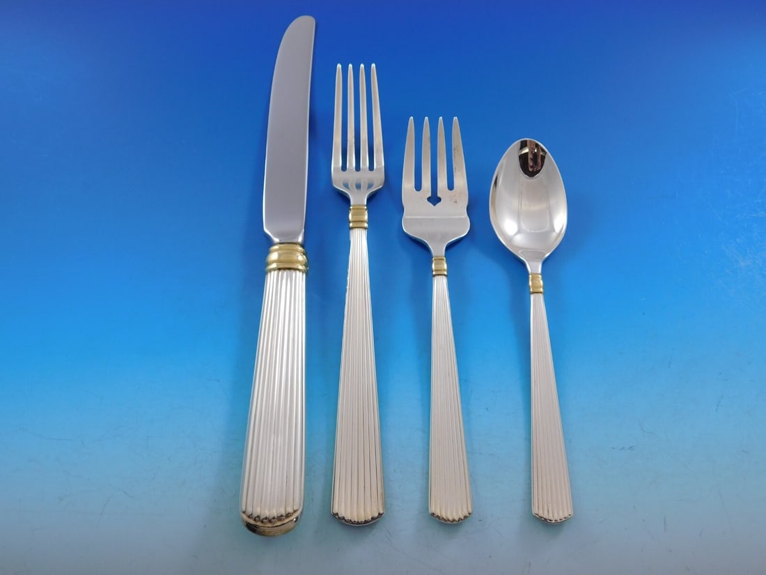 Reed & Barton Ashmont Gold Sterling Silver Flatware Set 39 pcs: Reed & Barton Ashmont Gold Sterling Silver Flatware Set 39 pcs Elevate your dining experience with the Ashmont Gold Sterling Silver Flatware Set by Reed & Barton. This exquisite 39-piece set features