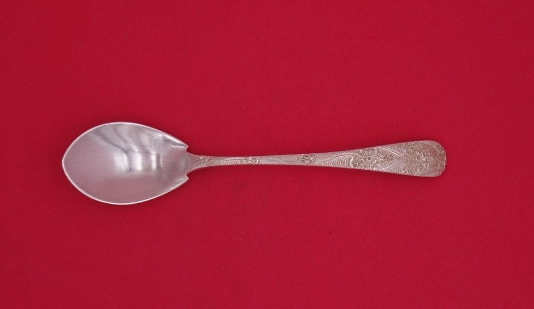 Tiffany & Co Antique Engraved Sterling Silver Ice Cream Spoon 6": Tiffany & Co Antique Engraved Sterling Silver Ice Cream Spoon 6" This exquisite ice cream spoon features an antique engraved pattern crafted by Tiffany & Co., a hallmark of luxury and artistry. Made f