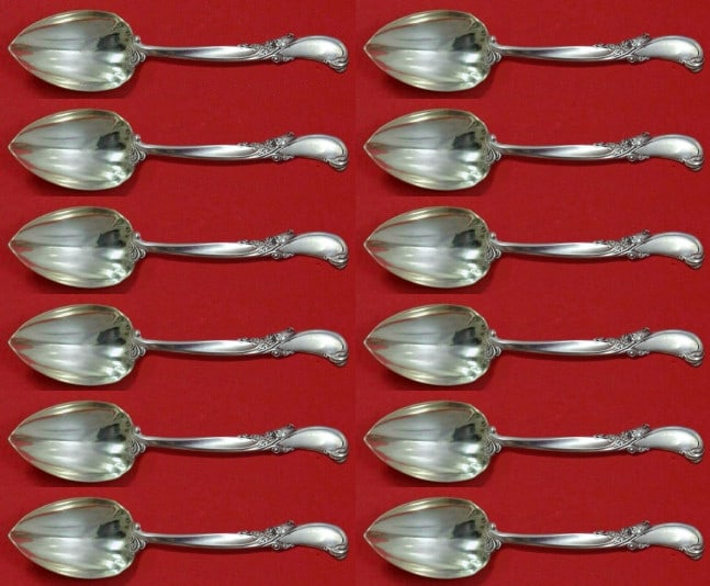 Wallace Sterling Silver Waltz of Spring 12 Piece Grapefruit Spoon Set: Wallace Sterling Silver Waltz of Spring 12 Piece Grapefruit Spoon Set This exquisite set features the "Waltz of Spring" pattern by Wallace, crafted from high-quality sterling silver. The custom-made s