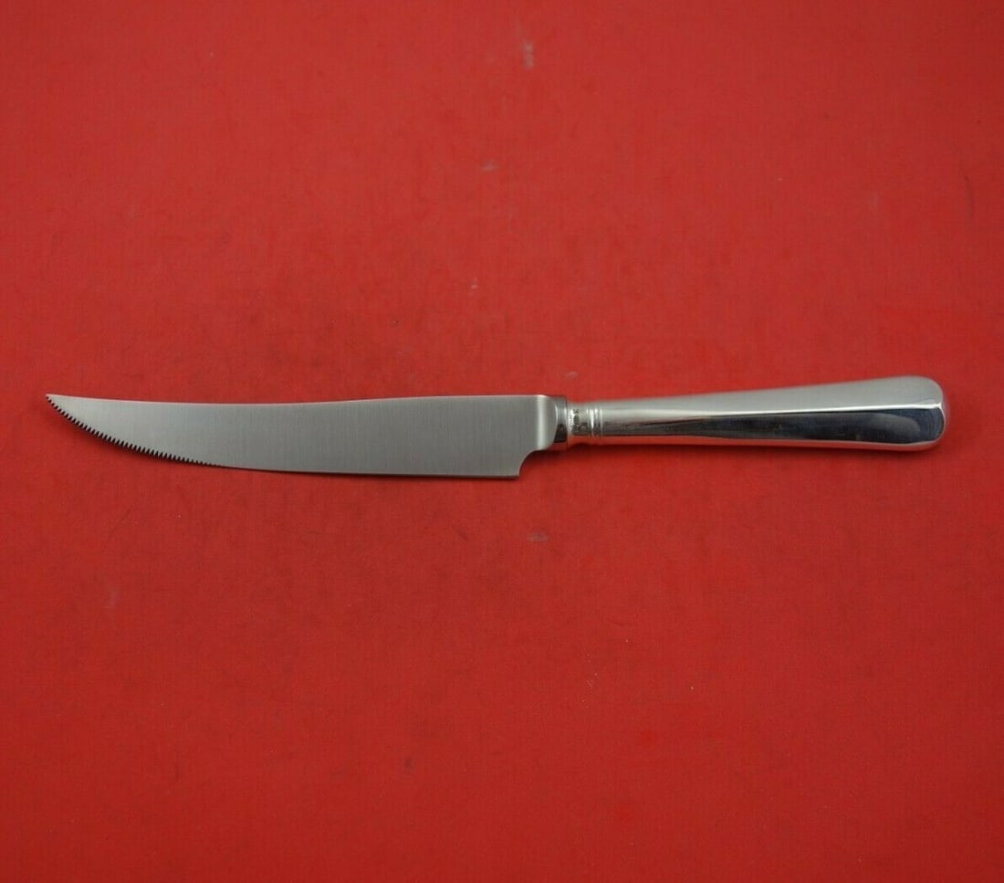 CJ Vander Rattail Sterling Silver Steak Knife 9 3/4 Inch: CJ Vander Rattail Sterling Silver Steak Knife 9 3/4 Inch This Rattail steak knife by CJ Vander features a sterling silver hollow handle paired with a serrated stainless steel blade, measuring 9 3/4 in