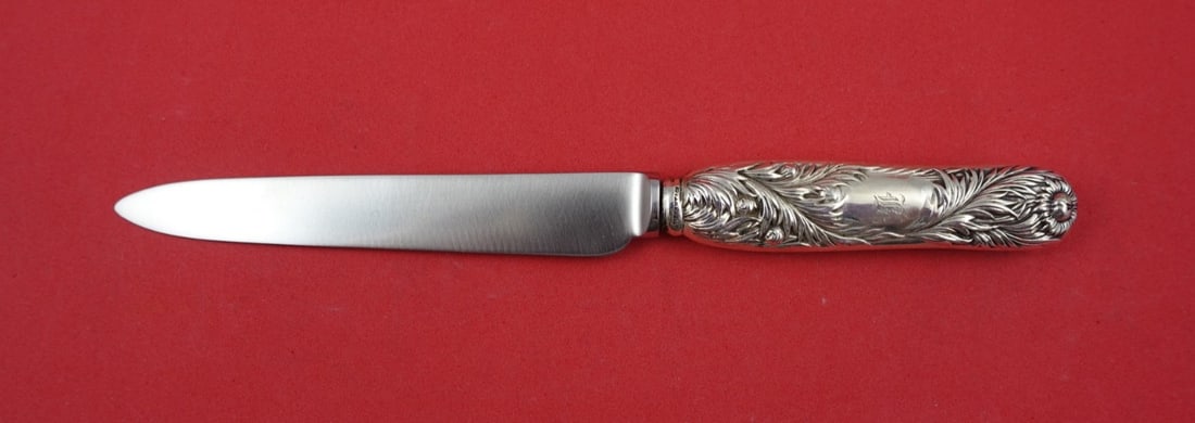 Sterling Silver Dessert Knife 7.5 Inch Chrysanthemum Pattern Tiffany & Co: Sterling Silver Dessert Knife 7.5 Inch Chrysanthemum Pattern Tiffany & Co This is a Chrysanthemum pattern dessert knife by Tiffany & Co., featuring a sterling silver hollow handle and a replacement no