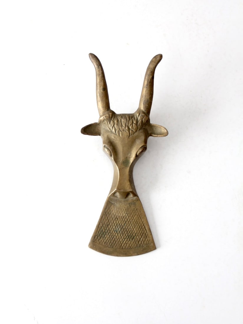 Vintage Mid-Century Brass Boot Jack with Antelope Head: Vintage Mid-Century Brass Boot Jack with Antelope Head Enhance your entryway or hearth with this vintage Mid-Century Brass Boot Jack. This functional piece features a sculptural antelope head with lon