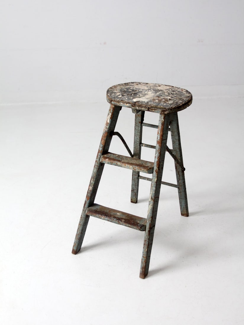 Rustic Gray Vintage Wooden Step Ladder with Cream Paint Splatter: Rustic Gray Vintage Wooden Step Ladder with Cream Paint Splatter This vintage wooden step ladder combines rustic charm with functionality. Featuring a weathered gray finish, it includes two rung steps