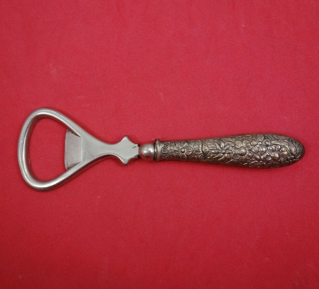 Manchester Southern Rose Sterling Silver Bottle Opener 4 3/4": Manchester Southern Rose Sterling Silver Bottle Opener 4 3/4" Discover the elegance of the Southern Rose bottle opener, crafted by Manchester between 1900 and 1940. This exquisite piece features a ste