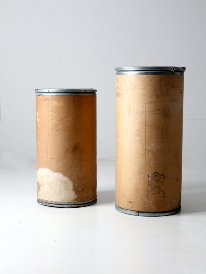 Pair of Vintage Industrial Farm Bins with Metal Rims: Pair of Vintage Industrial Farm Bins with Metal Rims Discover a charming pair of vintage industrial farm bins, perfect for adding character to your home. These unique paperboard canisters are accented