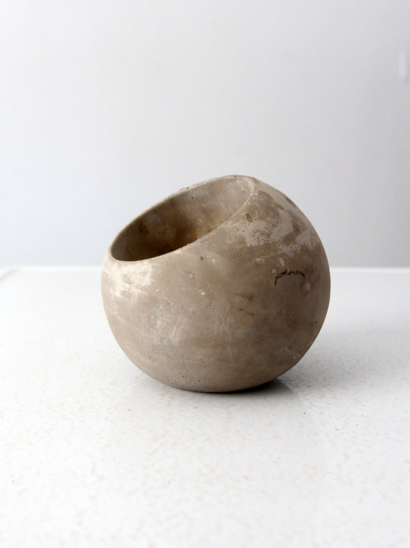 Vintage Cement Orb Planter 6 Inch Height Decorative Garden Accent: Vintage Cement Orb Planter 6 Inch Height Decorative Garden Accent Enhance your gardening aesthetic with this charming Vintage Cement Orb Planter. This round orb ball planter features a unique tilted s
