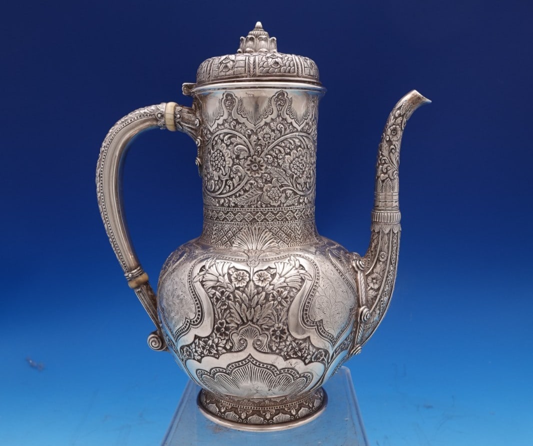 Tiffany & Co Persian Sterling Silver 5-Piece Tea Set: Tiffany & Co Persian Sterling Silver 5-Piece Tea Set Experience the elegance of the Persian tea set by Tiffany & Co., a stunning five-piece sterling silver collection crafted between 1850 and 1899. Th