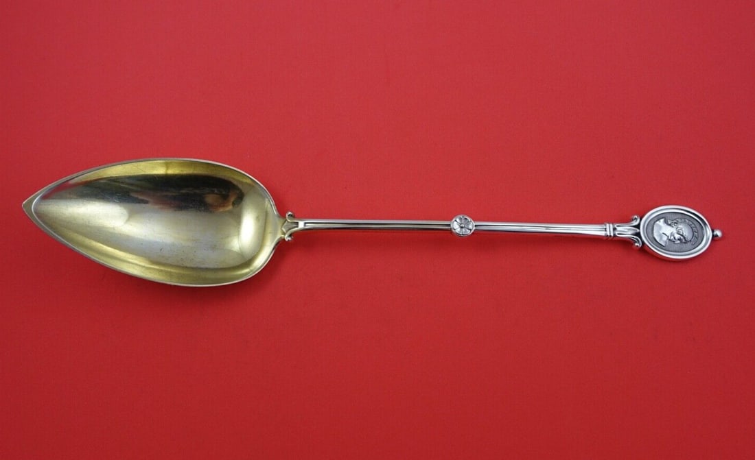 Wendt Medallion Sterling Silver Serving Spoon Gold Washed 11 3/4": Wendt Medallion Sterling Silver Serving Spoon Gold Washed 11 3/4" This exquisite serving spoon from the Medallion pattern by Wendt is crafted from high-quality sterling silver with a beautiful gold wa