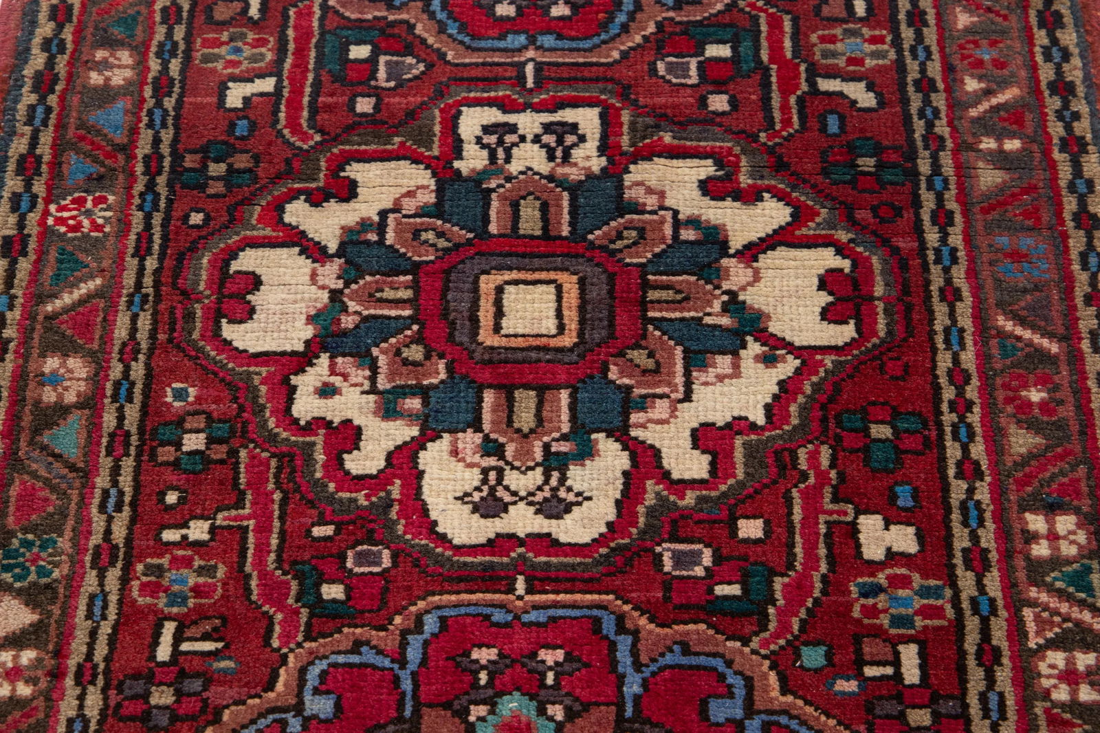 Vintage Persian Heriz Wool Runner Red Floral Medallion 2'7" x 10'2": Vintage Persian Heriz Wool Runner Red Floral Medallion 2'7" x 10'2" Enhance your space with this exquisite vintage Persian Handmade Heriz wool runner. Featuring a striking red field adorned with a vib