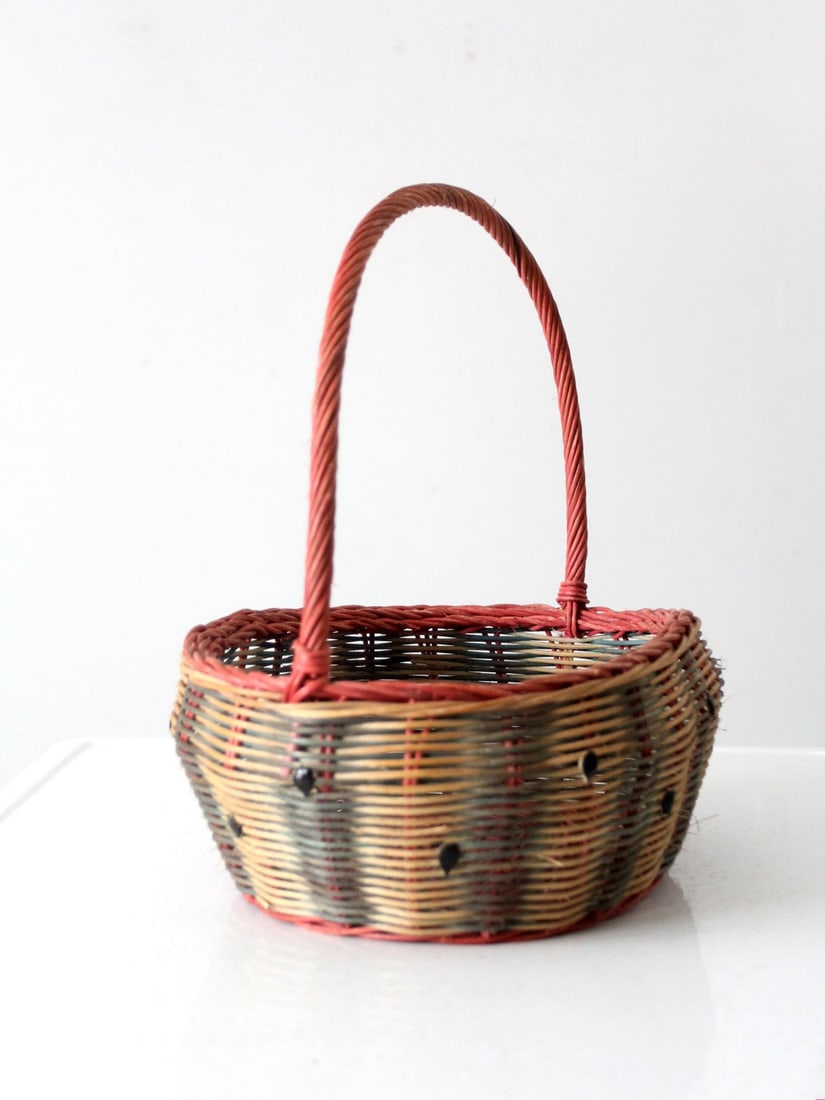 Quaint Vintage Watermelon Wicker Basket 16 x 11 x 14 Inches: Quaint Vintage Watermelon Wicker Basket 16 x 11 x 14 Inches This vintage wicker basket showcases a whimsical watermelon design, featuring soft, faded shades of red and green complemented by charming b