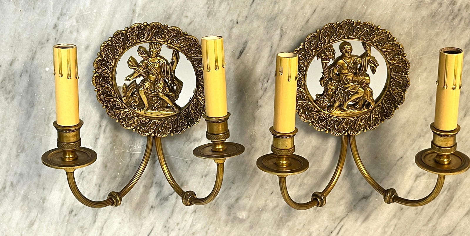 Neoclassical French Bronze Mirror Wall Sconces Set of 2 1950s: Neoclassical French Bronze Mirror Wall Sconces Set of 2 1950s This exquisite pair of French wall sconces from the 1950s showcases a stunning neoclassical design. Each sconce features a 5.5-inch diamet