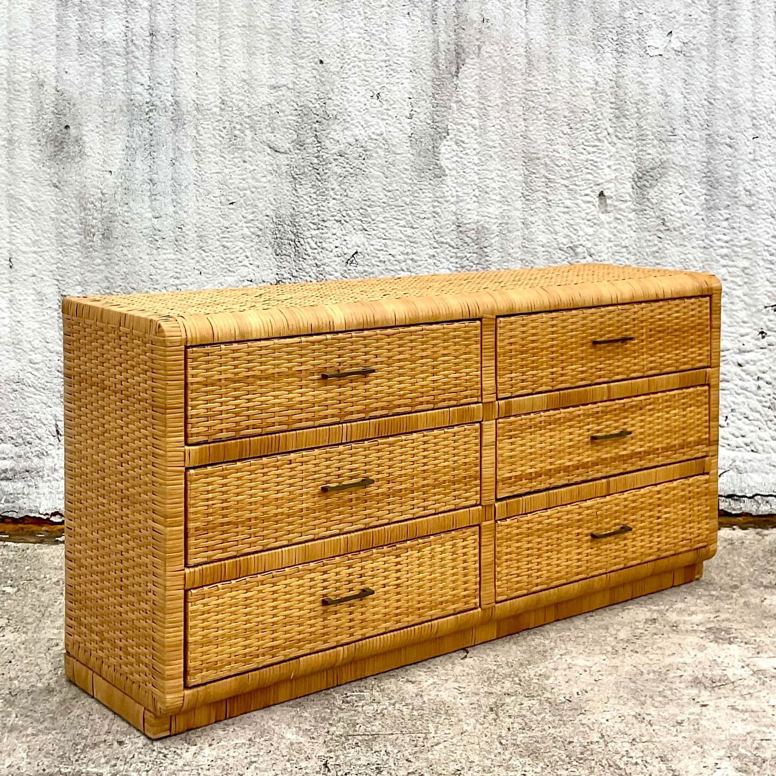 Vintage Coastal Rattan 6 Drawer Dresser: Vintage Coastal Rattan 6 Drawer Dresser Transform your space with this Vintage Coastal Wrapped Rattan 6 Drawer Dresser, a perfect addition for those who appreciate American coastal style. Expertly cra