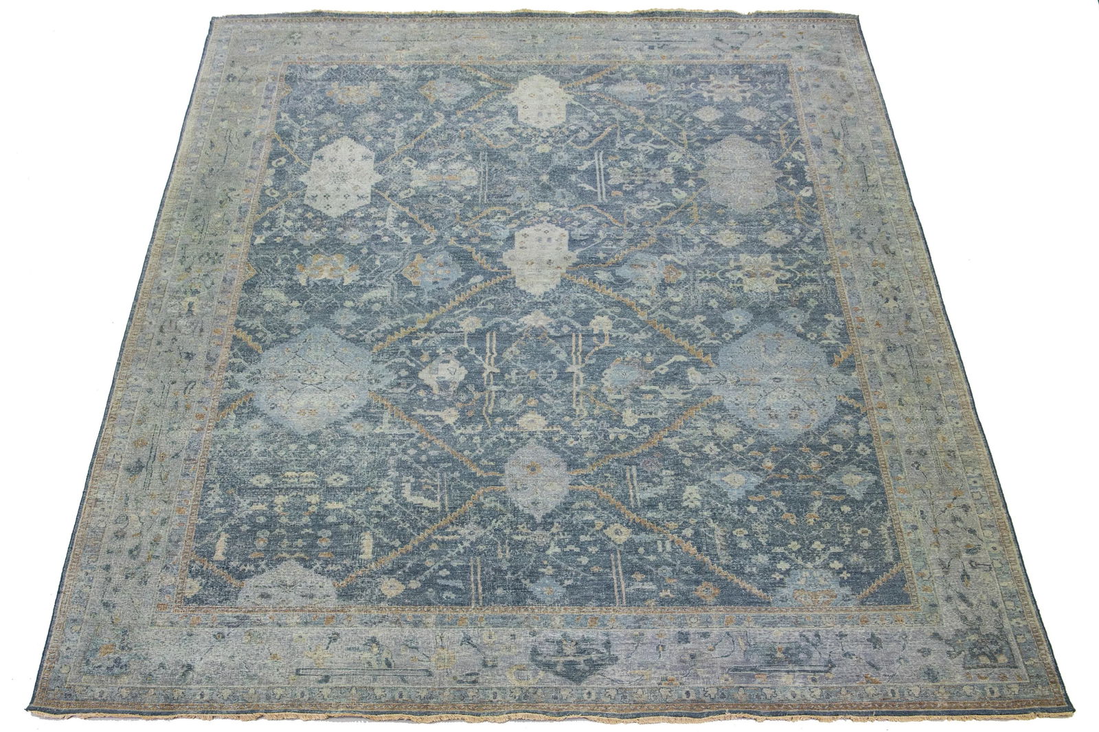 Handmade Blue Tabriz Wool Rug 11'9 x 15'3 Artisan Line: Handmade Blue Tabriz Wool Rug 11'9 x 15'3 Artisan Line This exquisite handmade wool rug from the Artisan Line features a stunning all-over floral design set against a rich blue color field. Perfect fo