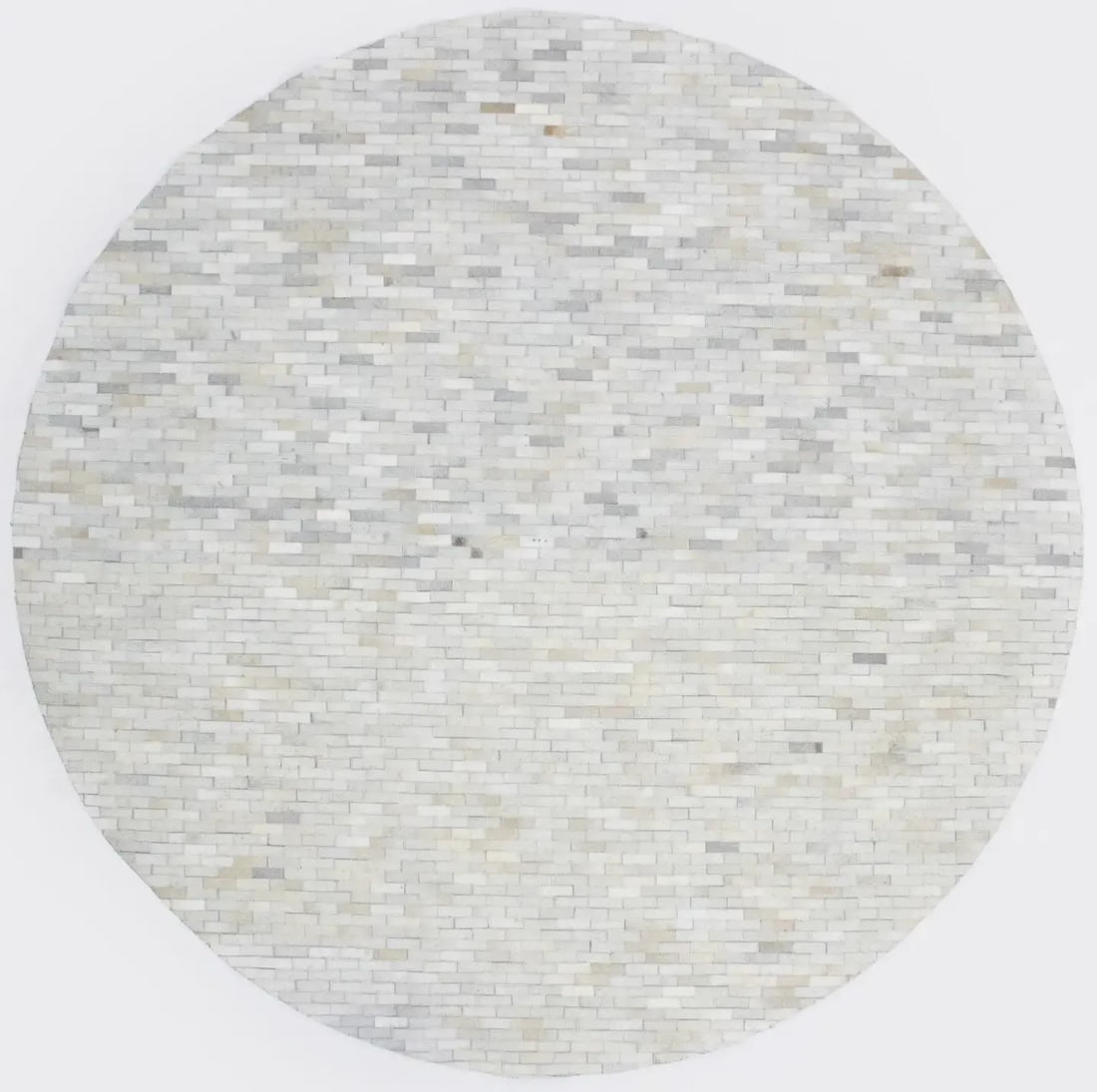 Round Hand-Crafted Beige and Brown Leather Area Rug Modern Design: Round Hand-Crafted Beige and Brown Leather Area Rug Modern Design Enhance your living space with this exquisite 8-foot round hand-crafted beige and brown cowhide leather rug. Featuring a modern geomet