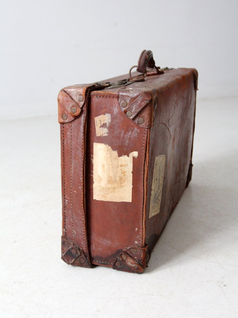 Vintage Leather Travel Case with Railway Stickers 24x7x14.5: Vintage Leather Travel Case with Railway Stickers 24x7x14.5 Discover a charming piece of travel history with this early 20th-century antique leather travel case. Featuring a beautifully aged patina, t