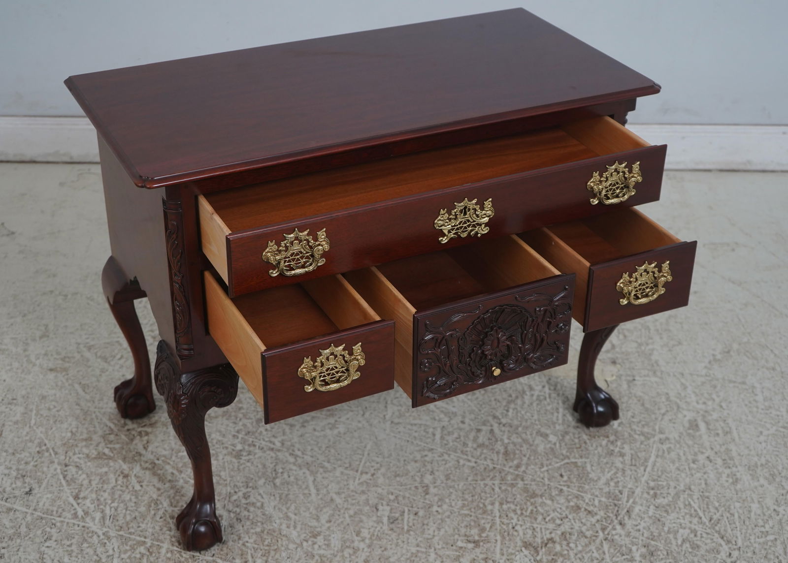Kindel Winterthur Mahogany Lowboy with Ball & Claw Feet: Kindel Winterthur Mahogany Lowboy with Ball & Claw Feet This exquisite Kindel Winterthur Ball & Claw Mahogany Lowboy features a rich reddish mahogany finish that beautifully showcases its Chippendale