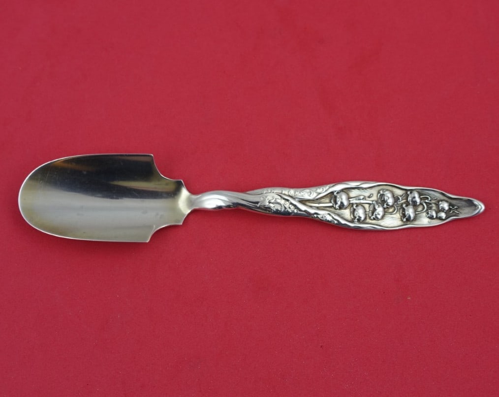 Whiting Sterling Silver Cheese Scoop 6 1/8" Lily of the Valley Pattern: Whiting Sterling Silver Cheese Scoop 6 1/8" Lily of the Valley Pattern Presenting a stunning cheese scoop from the renowned Whiting, featuring the elegant Lily of the Valley pattern. Crafted from high