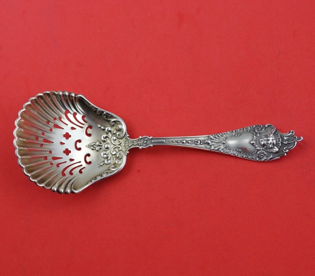 Watson-Newell Cherub Sterling Silver Nut Spoon 5.5 Inches Serving Spoon: Watson-Newell Cherub Sterling Silver Nut Spoon 5.5 Inches Serving Spoon This exquisite Sterling Silver Nut Spoon, crafted by Watson-Newell, features the charming Cherub pattern. Measuring 5 1/2 inches