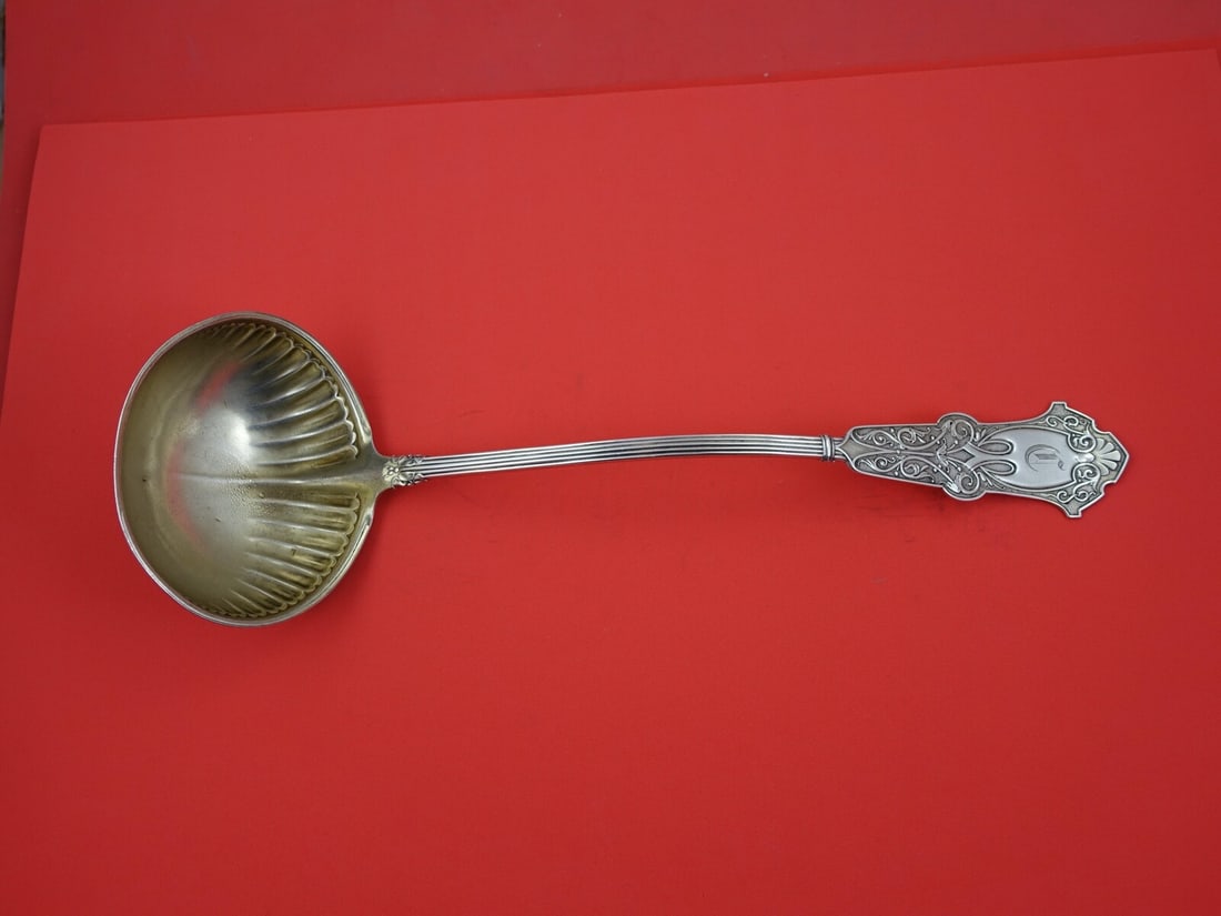 Whiting Alhambra Sterling Silver Soup Ladle Gold Wash 12 3/4": Whiting Alhambra Sterling Silver Soup Ladle Gold Wash 12 3/4" This exquisite soup ladle from the Alhambra pattern by Whiting is a stunning addition to any silverware collection. Crafted from sterling