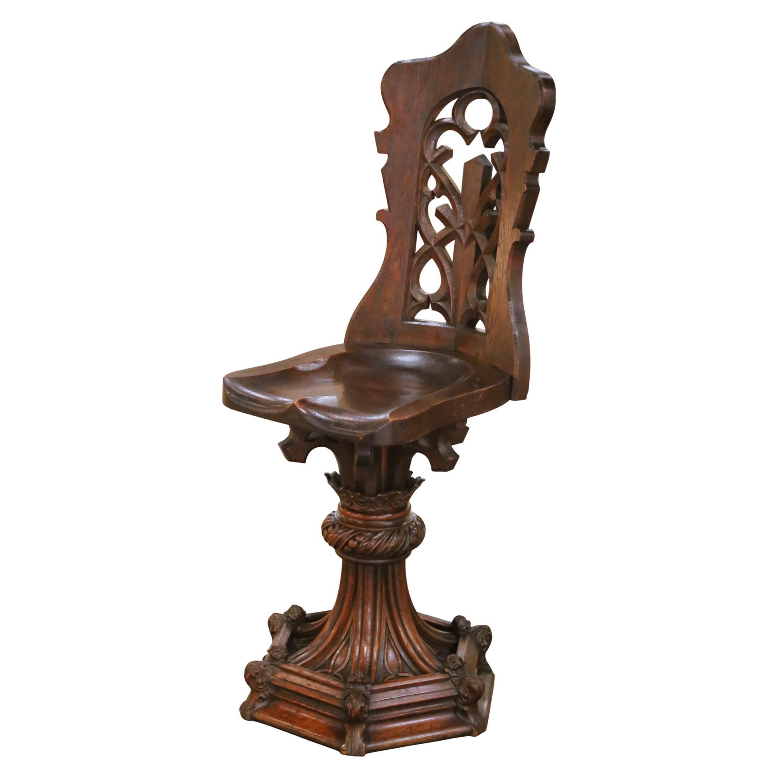 French Gothic Revival Oak Church Chair Circa 1870 Hand Carved Ecclesiastical Design: French Gothic Revival Oak Church Chair Circa 1870 Hand Carved Ecclesiastical Design This antique French chair, crafted circa 1870, embodies the Gothic Revival style with its architectural silhouette a