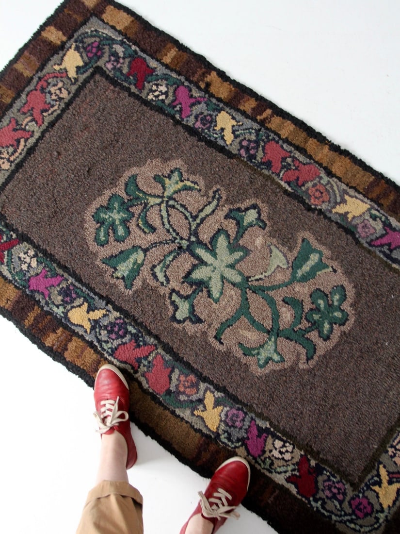19th Century Floral Antique Hooked Rug 65.5x35 Inch: 19th Century Floral Antique Hooked Rug 65.5x35 Inch Discover this exquisite 19th century antique hooked rug, showcasing a stunning floral design in rich hues of burgundy, magenta, gold, brick red, and