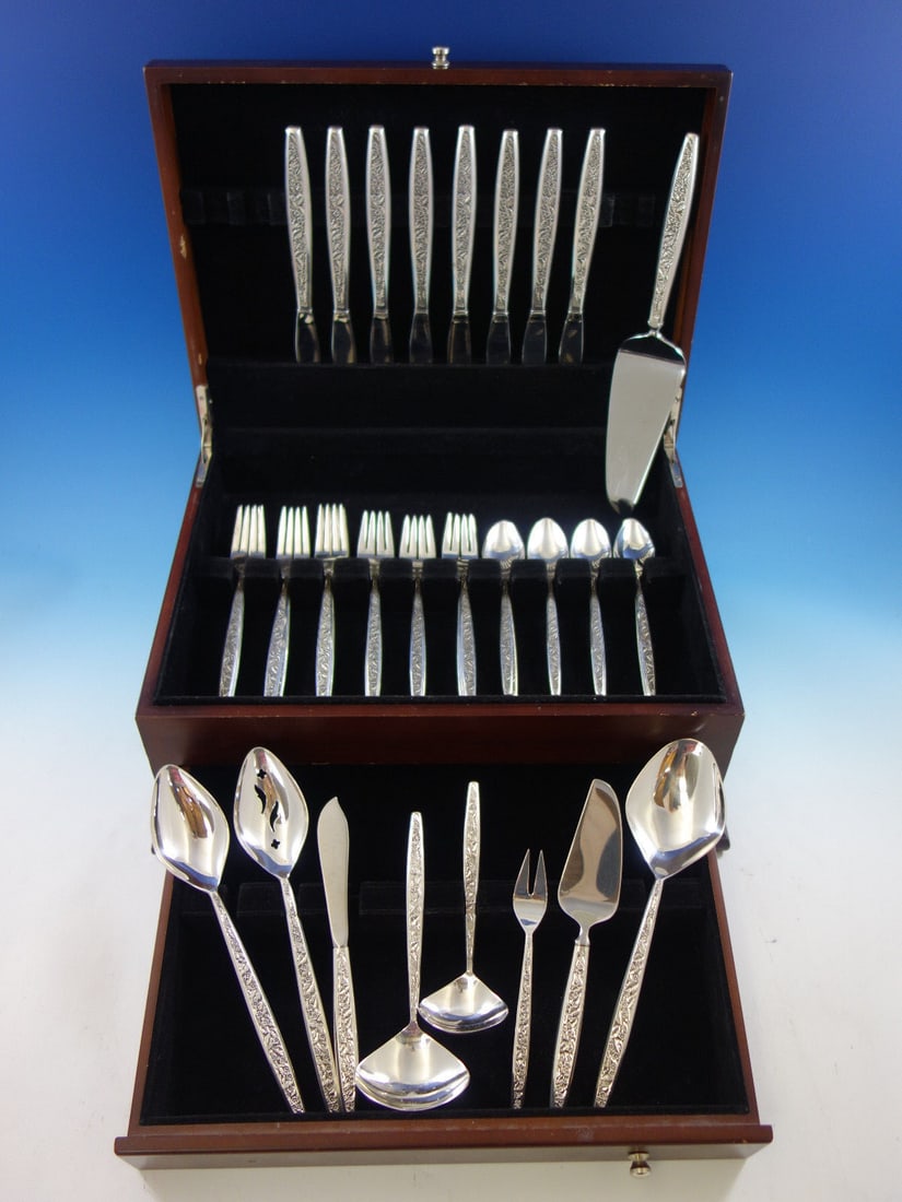 Valencia Sterling Silver Flatware Set for 8 by International Silver 41 Pieces: Valencia Sterling Silver Flatware Set for 8 by International Silver 41 Pieces Elevate your dining experience with the Valencia Flatware Set by International Sterling Silver. This post-1940 Mid-Century