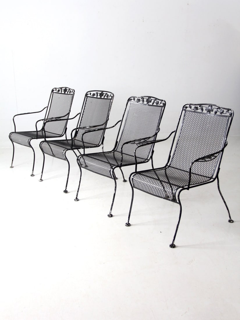 Set of 4 Vintage Mid Century Wrought Iron Patio Chairs: Set of 4 Vintage Mid Century Wrought Iron Patio Chairs Enhance your outdoor space with this stylish set of four mid-century wrought iron patio chairs. Crafted from durable black wrought iron, these di