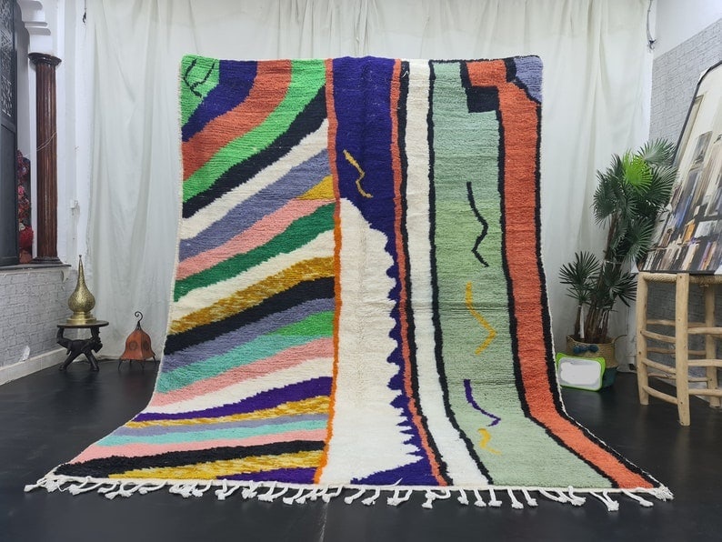 Authentic Moroccan Berber Handwoven Wool Rug 9.84 x 6.56 Feet: Authentic Moroccan Berber Handwoven Wool Rug 9.84 x 6.56 Feet Experience the charm of Moroccan craftsmanship with this elegant, colorful handwoven Berber wool rug. Each piece is meticulously crafted b