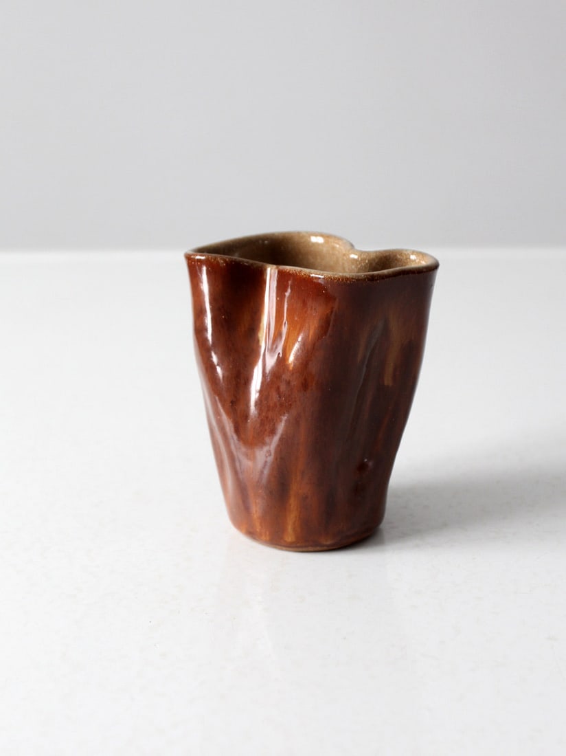 Signed Vintage Free Form Studio Pottery Vase with Rippled Russet Glaze: Signed Vintage Free Form Studio Pottery Vase with Rippled Russet Glaze This vintage studio pottery vase showcases a unique freeform design, characterized by its rippled texture and warm russet glaze.