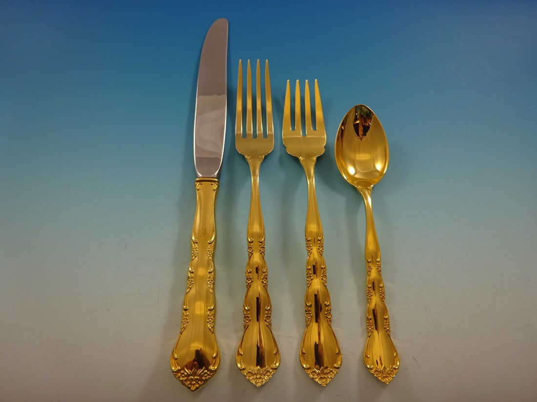 Kirk Vermeil Cheryl Gold Sterling Silver 4-Piece Place Setting: Kirk Vermeil Cheryl Gold Sterling Silver 4-Piece Place Setting Discover the elegance of the "Cheryl Gold" pattern by Kirk Vermeil, a stunning 4-piece place setting crafted from high-quality sterling s