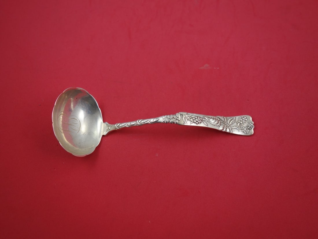 Tiffany & Co. Vine Sterling Silver Gravy Ladle with Raspberry Motif: Tiffany & Co. Vine Sterling Silver Gravy Ladle with Raspberry Motif Presenting an exquisite sterling silver gravy ladle from the renowned Vine pattern by Tiffany & Co., a true testament to fine crafts